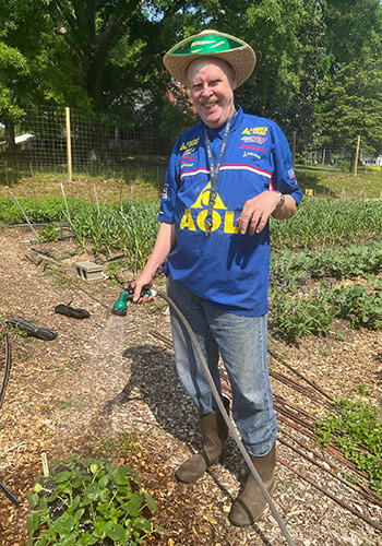 a man watering plants